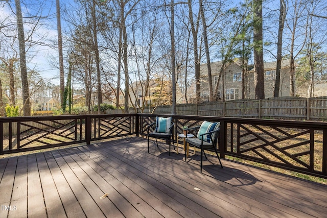 wooden deck featuring fence