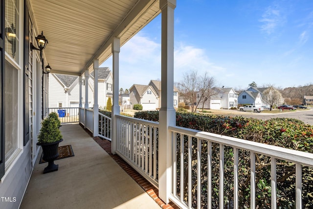 balcony featuring a residential view and covered porch