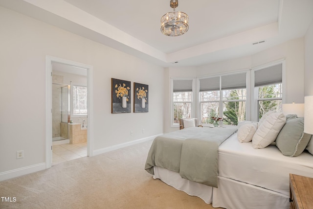 bedroom featuring visible vents, baseboards, a raised ceiling, light colored carpet, and a chandelier