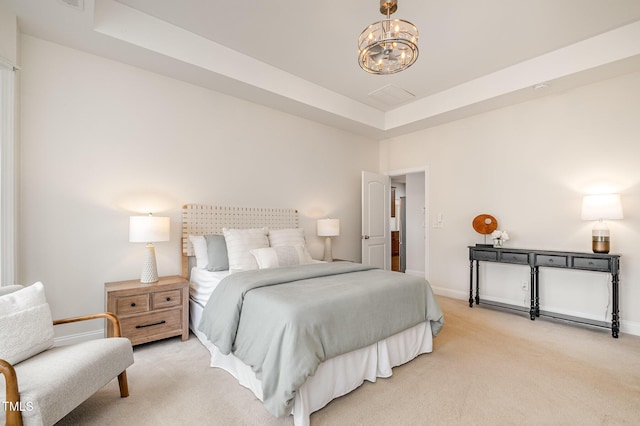 bedroom featuring an inviting chandelier, baseboards, a tray ceiling, and light carpet