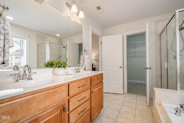 full bathroom featuring a sink, visible vents, a stall shower, and double vanity