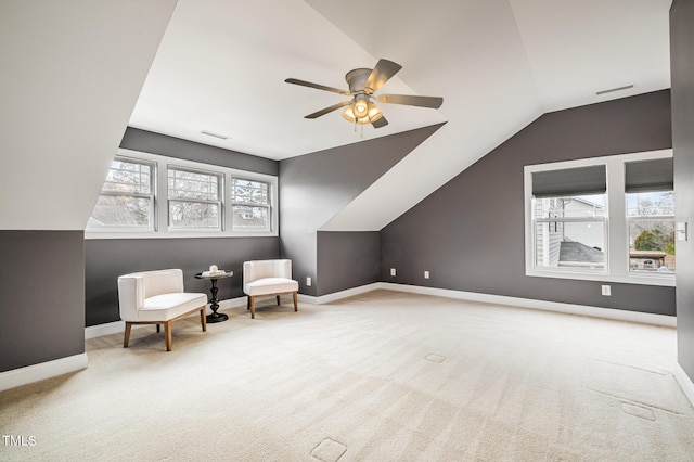 unfurnished room featuring baseboards, plenty of natural light, and carpet