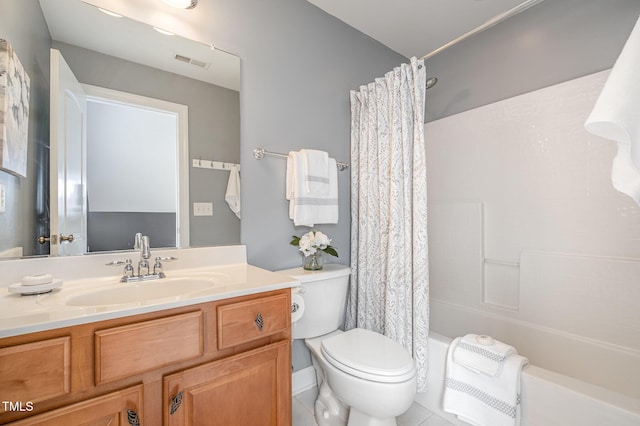 bathroom featuring vanity, toilet, shower / bath combo, and visible vents