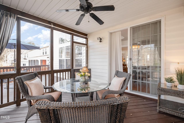 sunroom / solarium featuring wooden ceiling and a ceiling fan