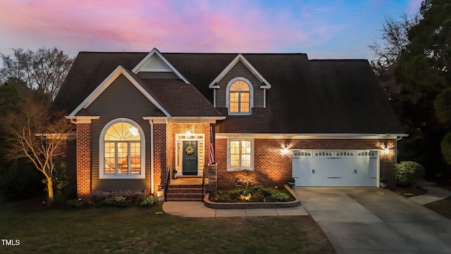 view of front of home featuring brick siding, a front lawn, concrete driveway, and a garage