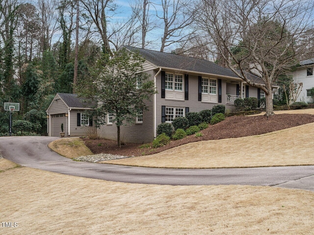 view of front of property with a garage and driveway