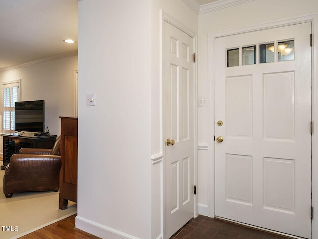 hall with recessed lighting, baseboards, brick floor, and ornamental molding