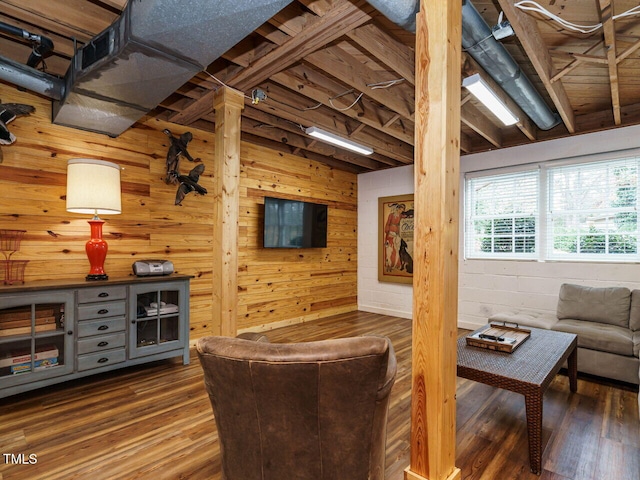 living room featuring wooden walls and wood finished floors