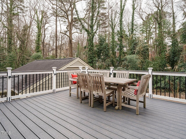 wooden deck featuring outdoor dining space