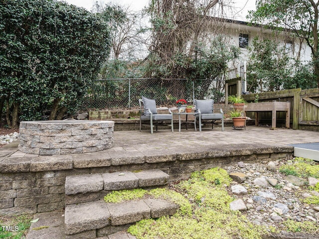 view of patio / terrace featuring fence