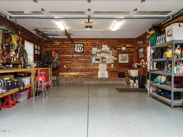 garage featuring a workshop area and a garage door opener