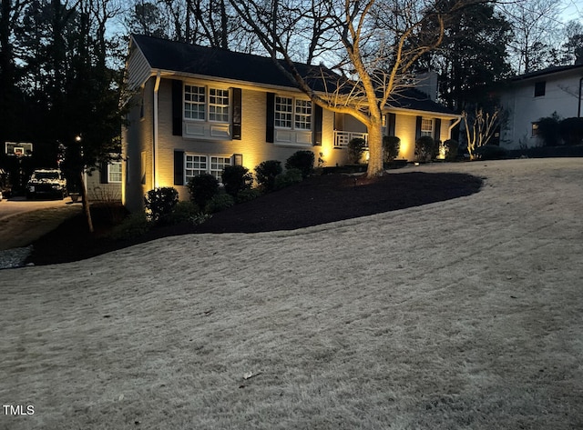 view of front of property featuring brick siding