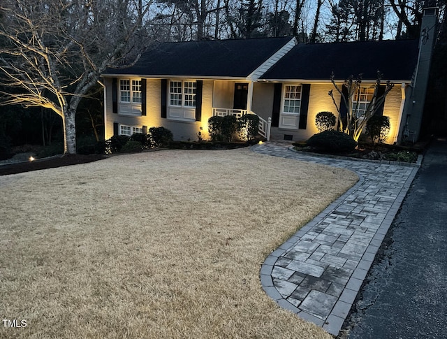 single story home with crawl space and brick siding