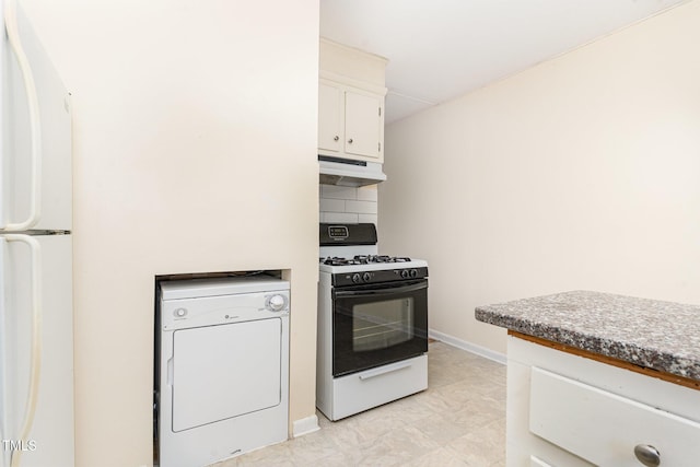 kitchen with white appliances, washer / clothes dryer, decorative backsplash, under cabinet range hood, and white cabinetry