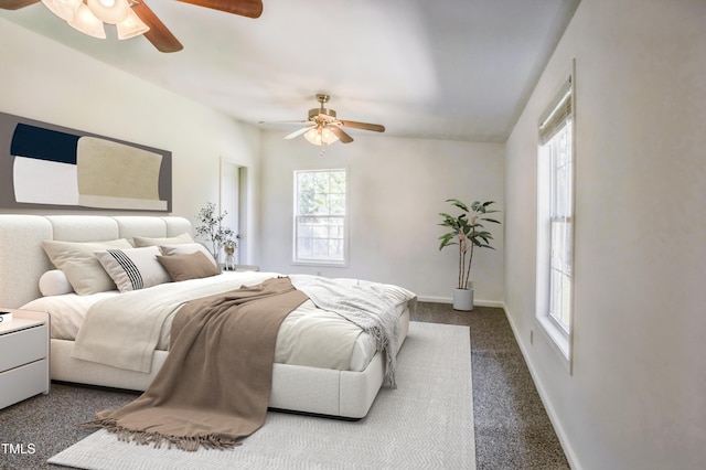 bedroom with baseboards, dark colored carpet, and a ceiling fan