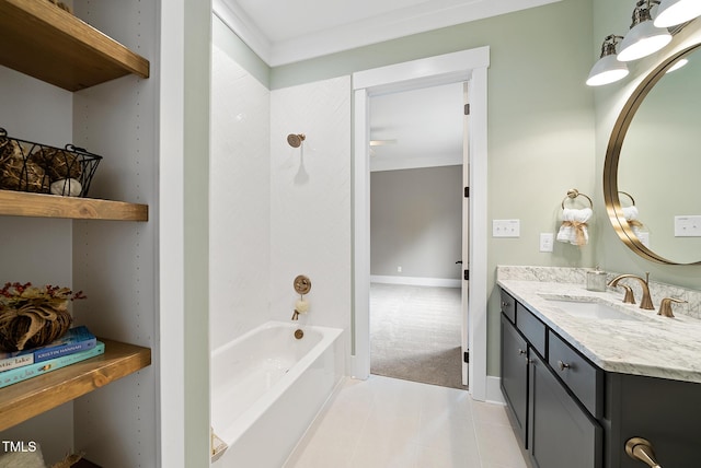 bathroom featuring tile patterned floors, washtub / shower combination, baseboards, and vanity