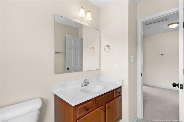 bathroom with vanity and toilet