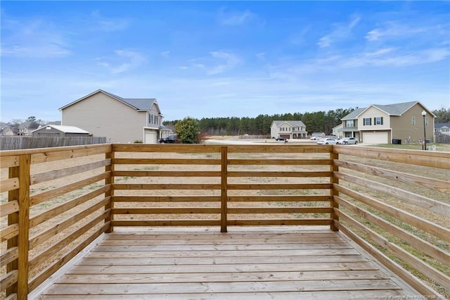 wooden terrace with a residential view