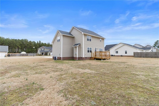 back of house with central AC unit, a lawn, crawl space, fence, and a deck