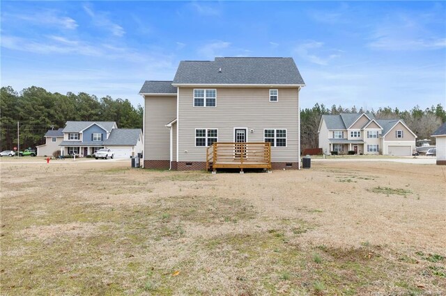 back of property with crawl space and a wooden deck