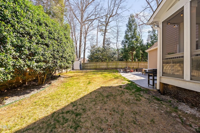 view of yard with a patio and a fenced backyard