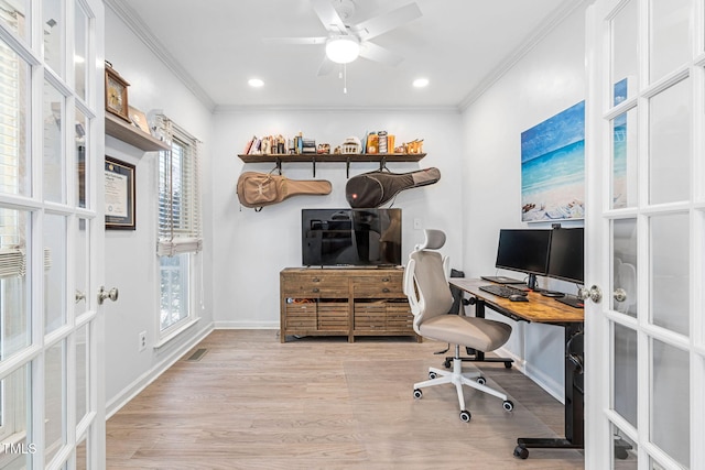 office space with visible vents, french doors, crown molding, and wood finished floors