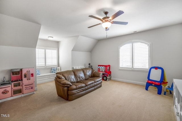 rec room with carpet, baseboards, visible vents, ceiling fan, and vaulted ceiling