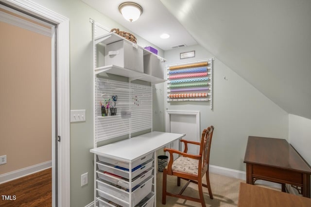 office with lofted ceiling, baseboards, and visible vents