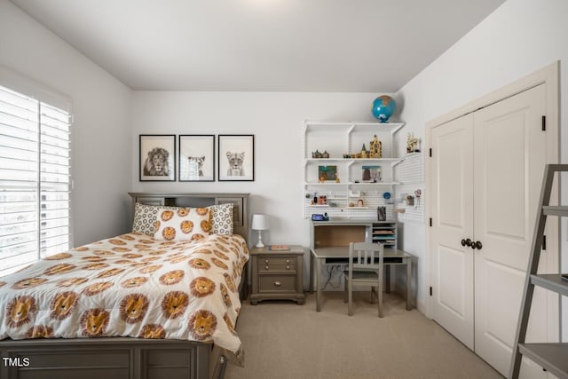 carpeted bedroom featuring a closet