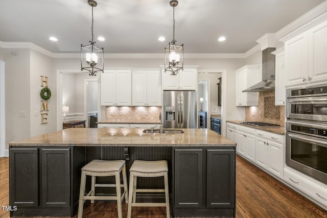 kitchen with a spacious island, appliances with stainless steel finishes, white cabinetry, and dark wood-type flooring