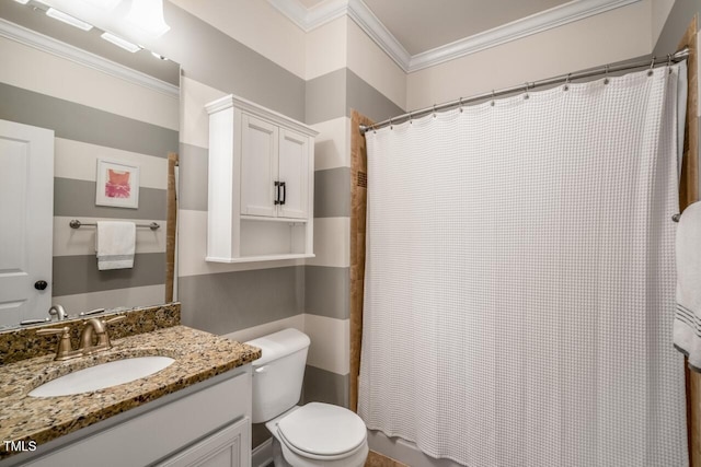 bathroom featuring a shower with shower curtain, vanity, toilet, and crown molding