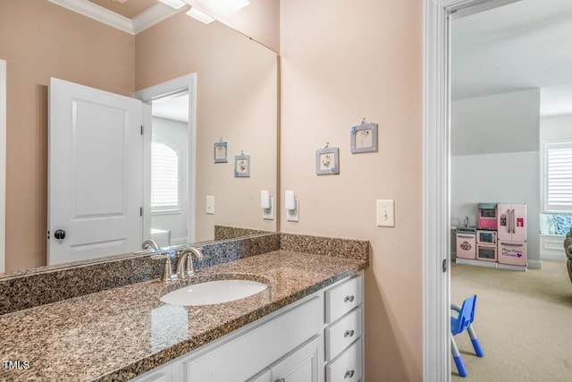 bathroom featuring vanity and crown molding