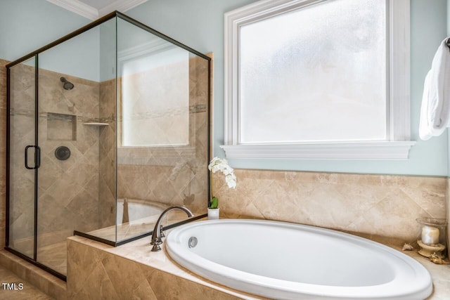 full bath featuring a shower stall, crown molding, and a garden tub