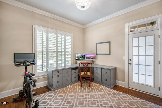 office area with wood finished floors, baseboards, and ornamental molding