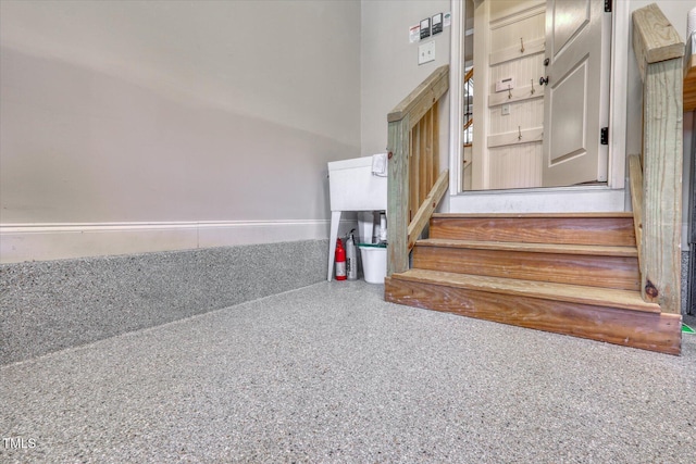 stairs featuring speckled floor