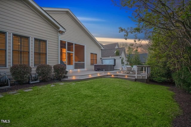 view of yard featuring a wooden deck and a hot tub