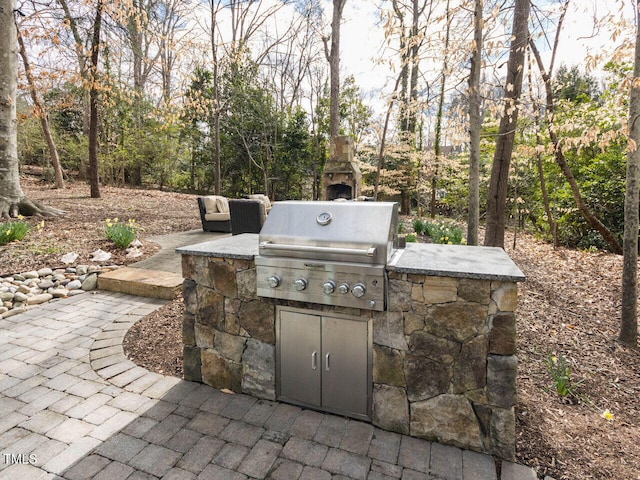 view of patio featuring area for grilling and exterior kitchen