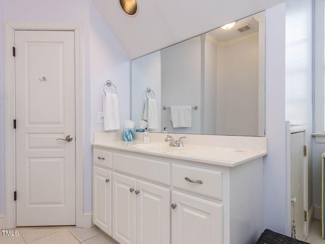 bathroom with tile patterned floors, visible vents, and vanity