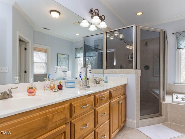 bathroom featuring a sink, visible vents, and crown molding