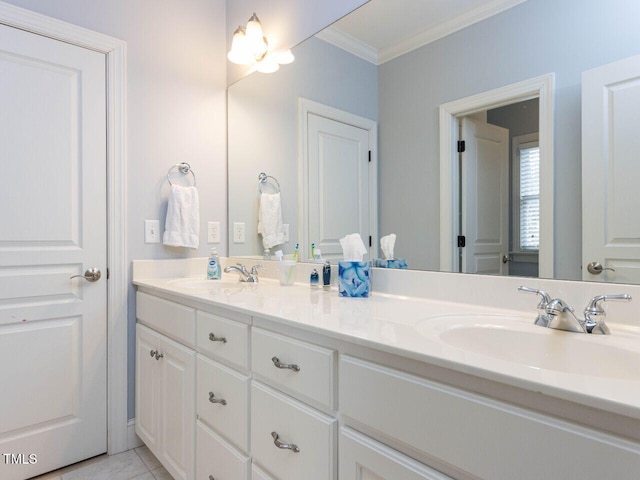 bathroom featuring tile patterned flooring, double vanity, ornamental molding, and a sink