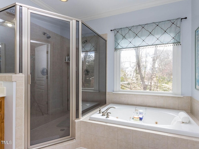 full bathroom with vanity, a tub with jets, a stall shower, and ornamental molding