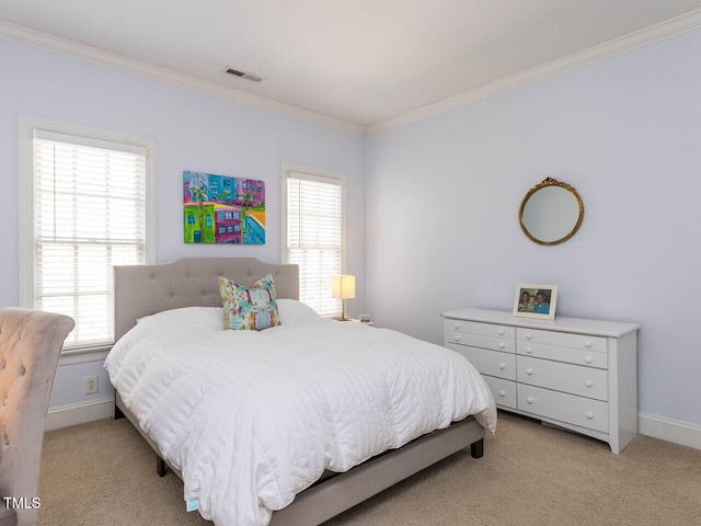 bedroom featuring crown molding, multiple windows, light colored carpet, and visible vents