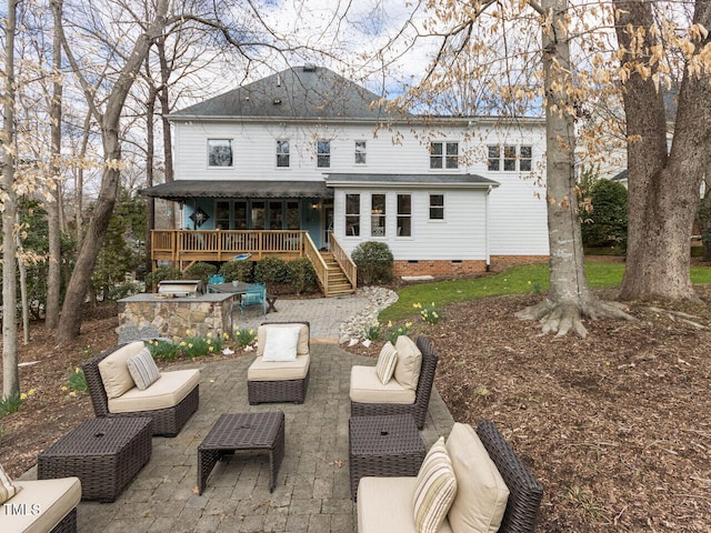 rear view of house featuring crawl space, a patio area, an outdoor living space, and a deck