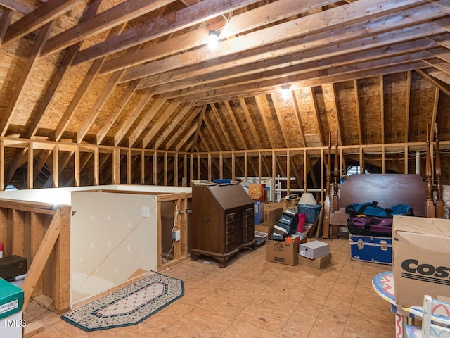 attic featuring an upstairs landing