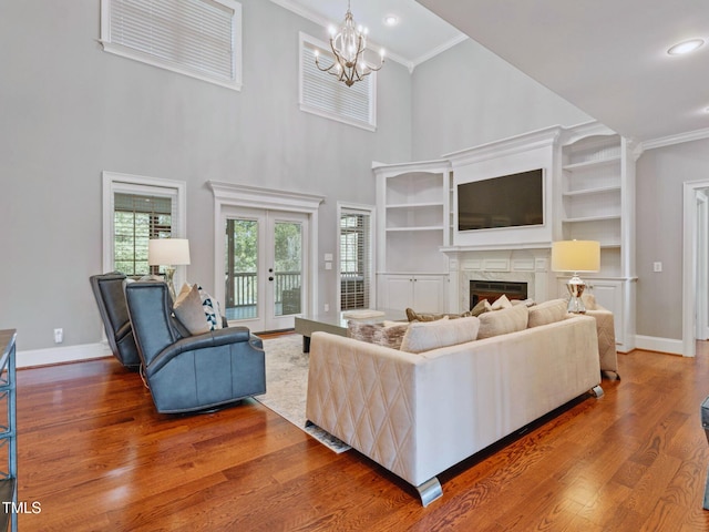 93 Shoreline Dr, Princeton, NC 27569 - living room with crown molding, wood finished floors, baseboards, and a high end fireplace