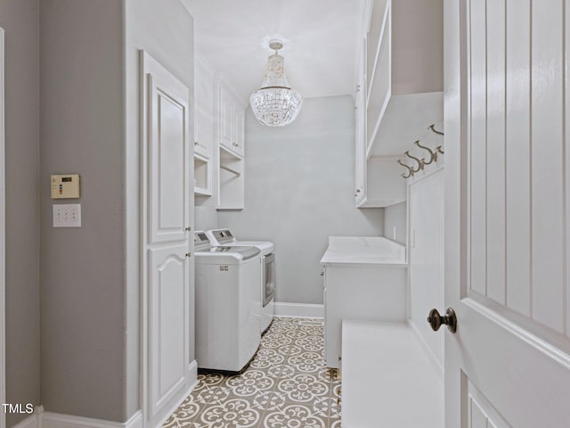 93 Shoreline Dr, Princeton, NC 27569 - laundry room with washing machine and clothes dryer, a chandelier, cabinet space, and baseboards