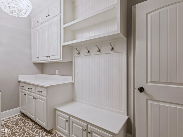 93 Shoreline Dr, Princeton, NC 27569 - mudroom featuring a chandelier and baseboards