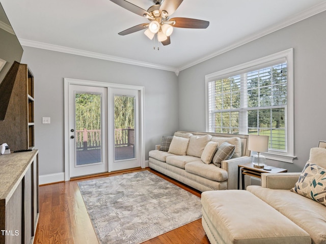 93 Shoreline Dr, Princeton, NC 27569 - living room with a healthy amount of sunlight, crown molding, baseboards, and wood finished floors