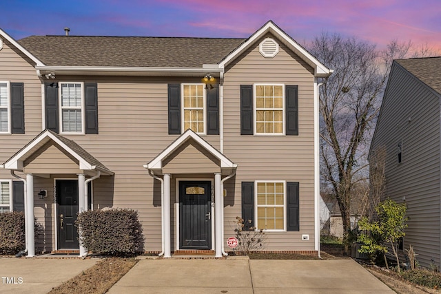 view of front of home with a shingled roof