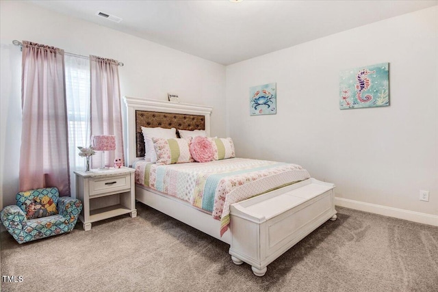 carpeted bedroom featuring visible vents and baseboards